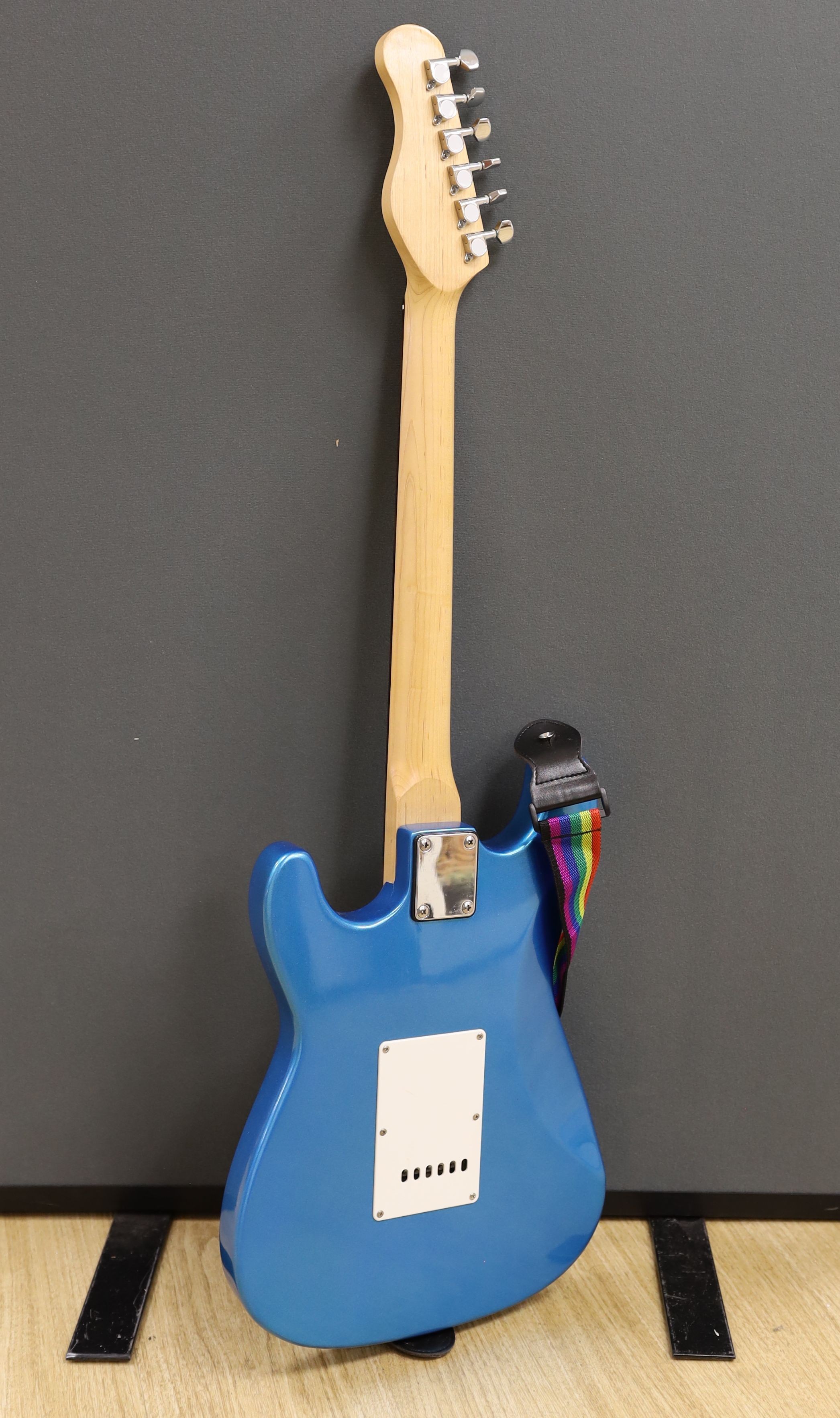 A Huntingdon electric guitar, stand not included, guitar 102 cms high.